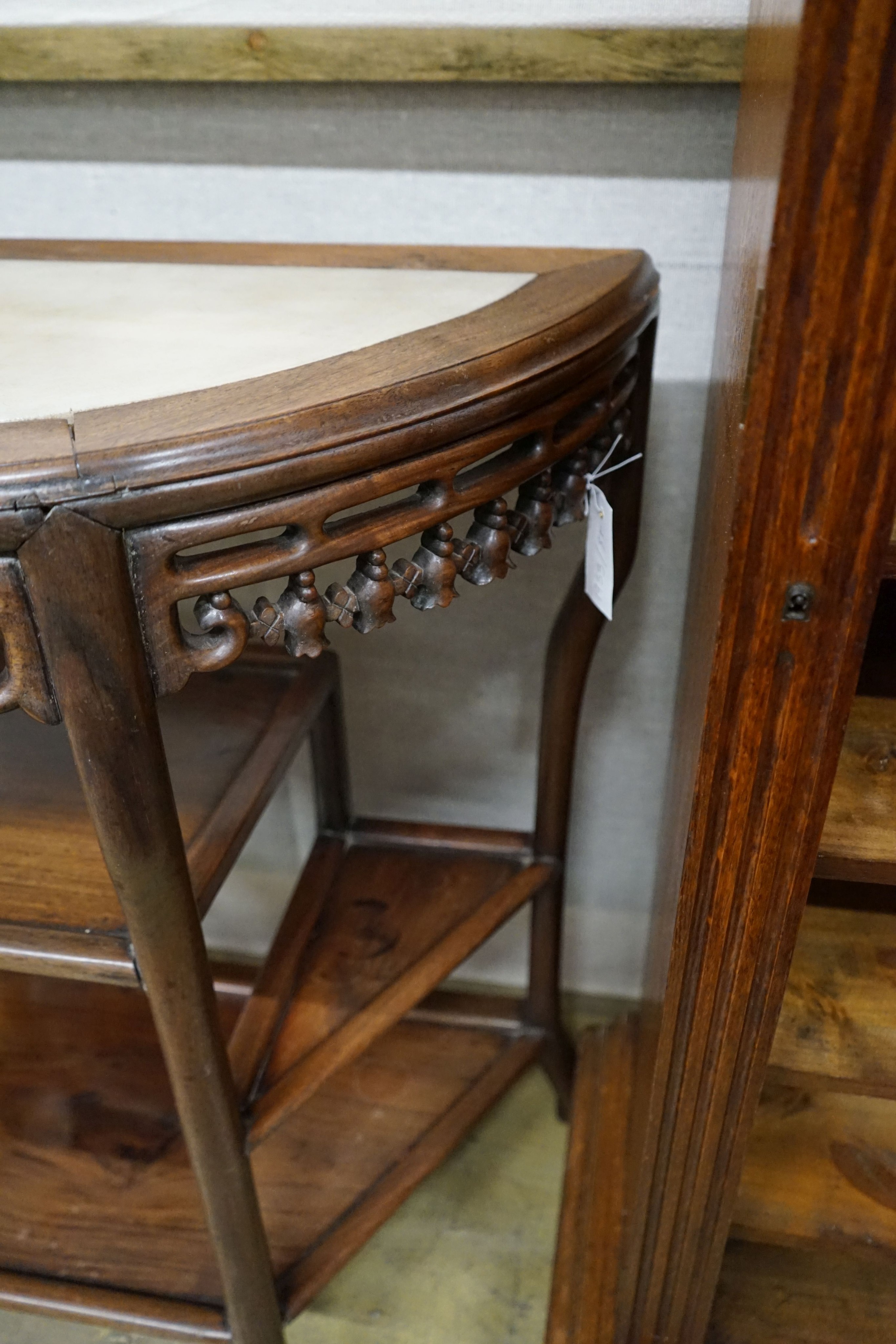 A pair of Chinese marble-topped demi lune console tables, width 82cm, depth 40cm, height 80cm